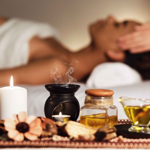 african-woman-having-face-massage-relaxing-spa-salon-enjoying-aroma-therapy (1)